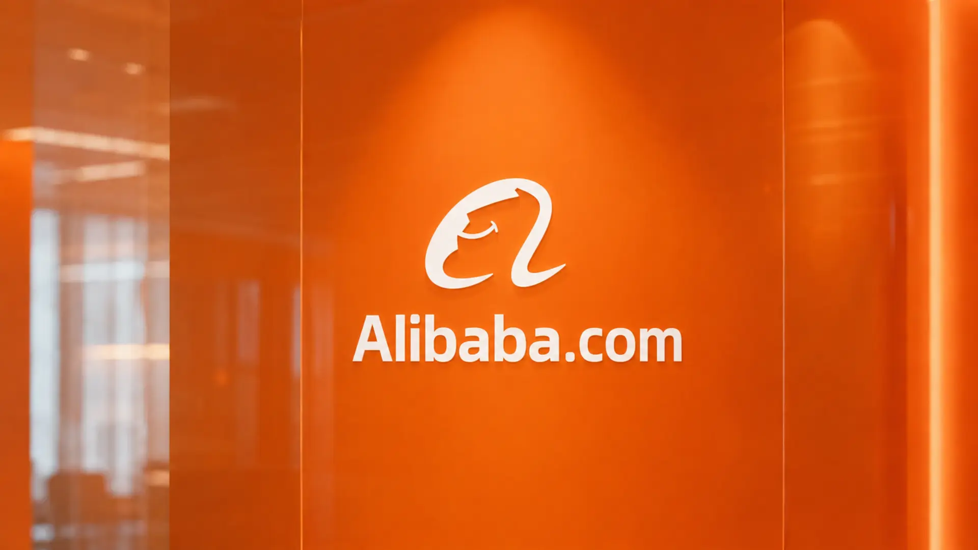 Alibaba.com logo displayed on an orange corporate wall